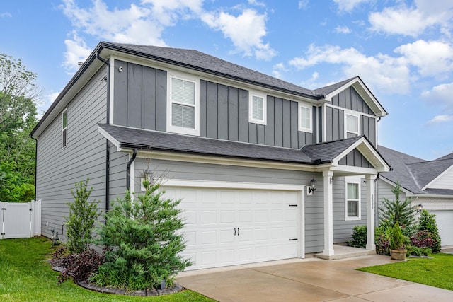 3308 Longstalk Rd, Antioch, TN 37013 - view of front of home featuring board and batten siding, a garage, driveway, and a gate
