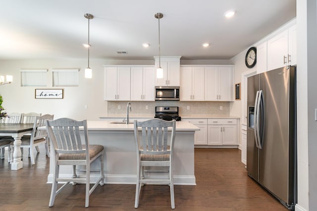 3308 Longstalk Rd, Antioch, TN 37013 - kitchen featuring stainless steel appliances, a sink, light countertops, white cabinetry, and decorative backsplash