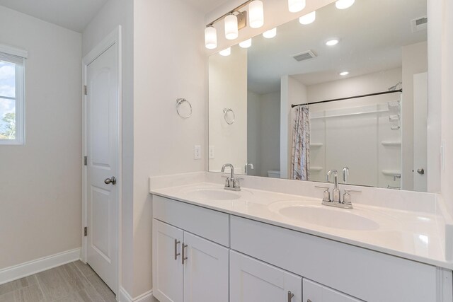 3308 Longstalk Rd, Antioch, TN 37013 - full bathroom featuring baseboards, toilet, double vanity, a shower with curtain, and recessed lighting