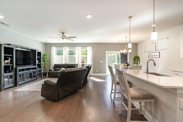 3308 Longstalk Rd, Antioch, TN 37013 - living area featuring dark wood finished floors, ceiling fan, baseboards, a chandelier, and recessed lighting