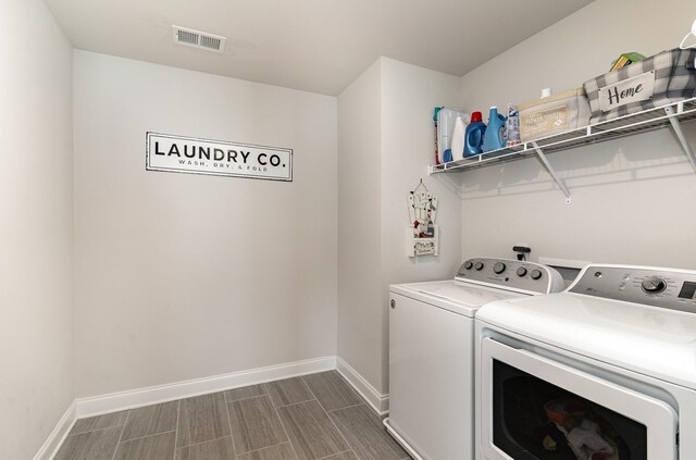 3308 Longstalk Rd, Antioch, TN 37013 - washroom with separate washer and dryer, baseboards, and wood finish floors