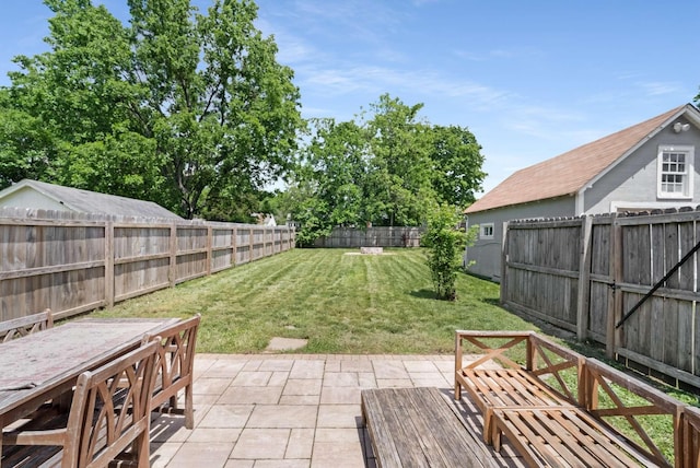 view of yard featuring a patio area and outdoor dining area