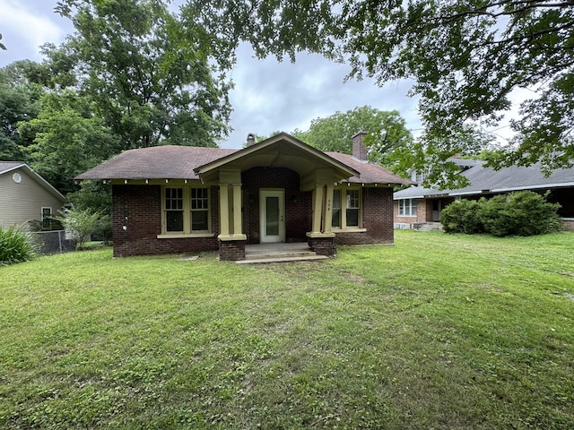 226 Highland St, Ripley, TN 38063 - view of front of house featuring brick siding and a chimney