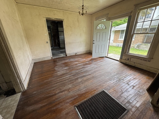 226 Highland St, Ripley, TN 38063 - unfurnished dining area with hardwood / wood-style floors and a chandelier