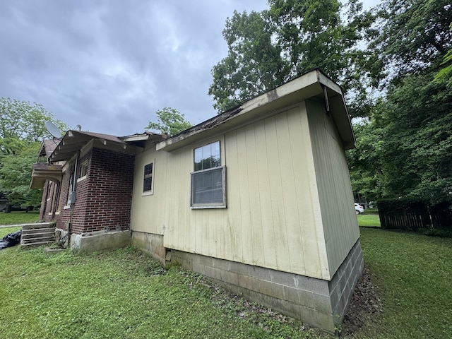 226 Highland St, Ripley, TN 38063 - view of side of property with a yard