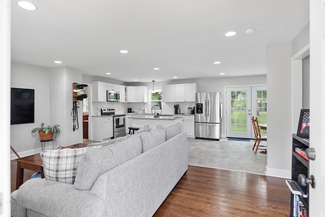 131 Mcdavid St, Gallatin, TN 37066 - living room with healthy amount of natural light, recessed lighting, baseboards, and dark wood finished floors