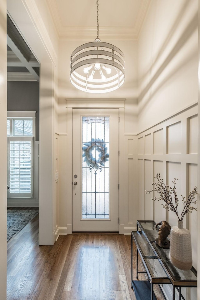 1219 Ben Forkum Dr, Lebanon, TN 37087 - doorway to outside featuring healthy amount of natural light, ornamental molding, wood finished floors, a chandelier, and beam ceiling