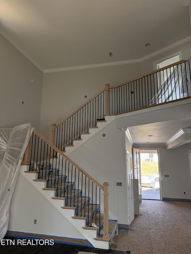 2412 Misty Mountain Cir, Knoxville, TN 37932 - staircase with ornamental molding, baseboards, and a towering ceiling