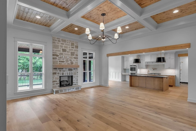 848 Brook Trl, Lebanon, TN 37087 - kitchen with open floor plan, coffered ceiling, light wood-type flooring, a chandelier, and beam ceiling