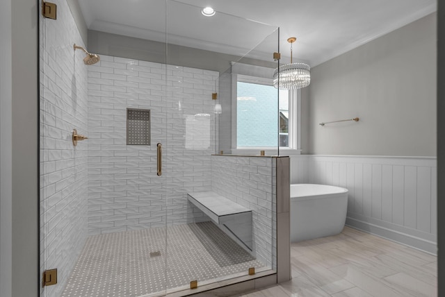848 Brook Trl, Lebanon, TN 37087 - bathroom with a shower stall, a freestanding tub, a wainscoted wall, a chandelier, and marble finish floors