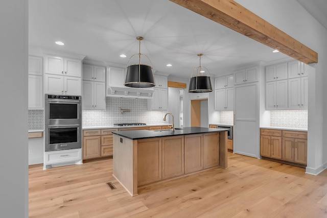 848 Brook Trl, Lebanon, TN 37087 - kitchen featuring stainless steel appliances, a sink, backsplash, recessed lighting, and light wood-type flooring