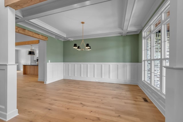 848 Brook Trl, Lebanon, TN 37087 - unfurnished dining area with beamed ceiling, a chandelier, light wood-style flooring, wainscoting, and a decorative wall