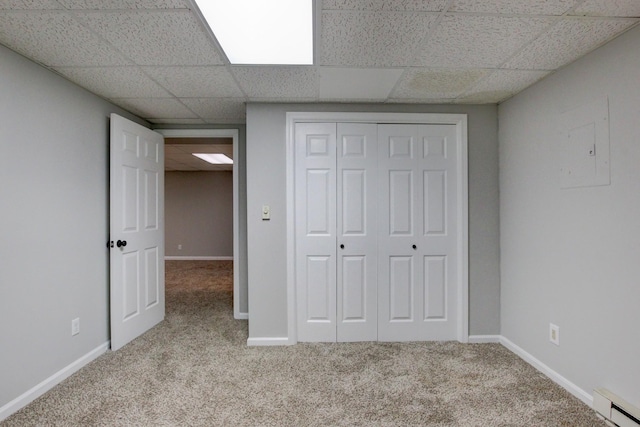 1420 E Rhett Butler Rd, Clarksville, TN 37042 - unfurnished bedroom featuring carpet floors, baseboard heating, a drop ceiling, a closet, and baseboards