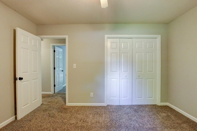 1420 E Rhett Butler Rd, Clarksville, TN 37042 - unfurnished bedroom featuring carpet, baseboards, a closet, and a ceiling fan