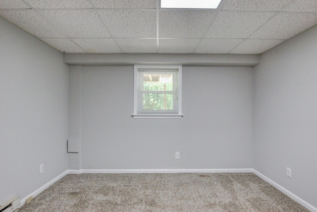 1420 E Rhett Butler Rd, Clarksville, TN 37042 - empty room with a baseboard heating unit, carpet floors, baseboards, and a drop ceiling