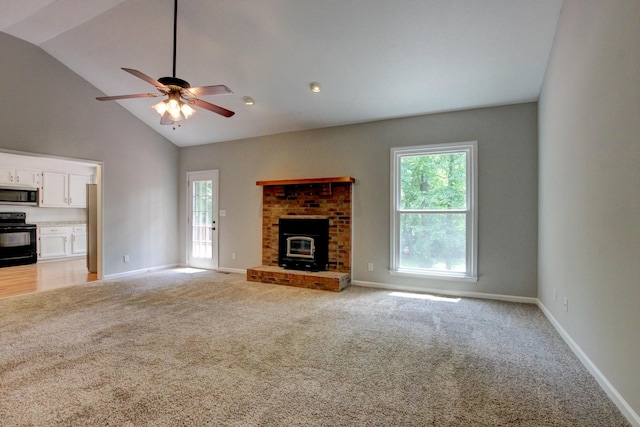 1420 E Rhett Butler Rd, Clarksville, TN 37042 - unfurnished living room featuring healthy amount of natural light, a ceiling fan, light carpet, and high vaulted ceiling