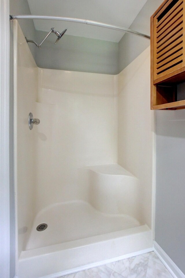 1420 E Rhett Butler Rd, Clarksville, TN 37042 - full bathroom featuring a stall shower and baseboards