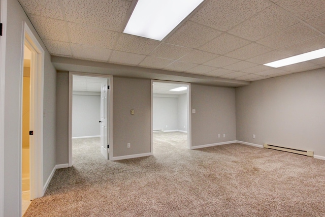 1420 E Rhett Butler Rd, Clarksville, TN 37042 - unfurnished room with a baseboard heating unit, carpet flooring, a drop ceiling, and baseboards