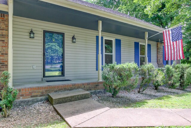 1420 E Rhett Butler Rd, Clarksville, TN 37042 - property entrance with a porch and brick siding