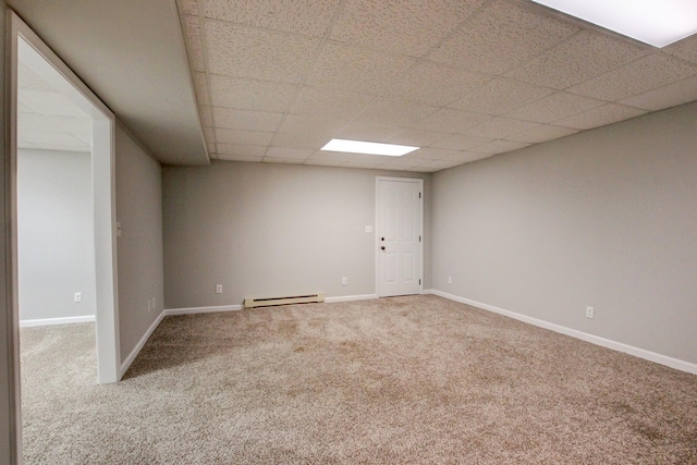 1420 E Rhett Butler Rd, Clarksville, TN 37042 - carpeted empty room with a baseboard radiator, a drop ceiling, and baseboards