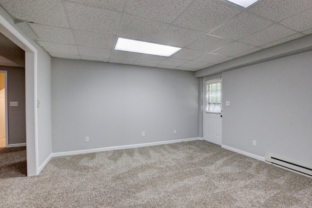 1420 E Rhett Butler Rd, Clarksville, TN 37042 - spare room featuring carpet floors, baseboard heating, a paneled ceiling, and baseboards