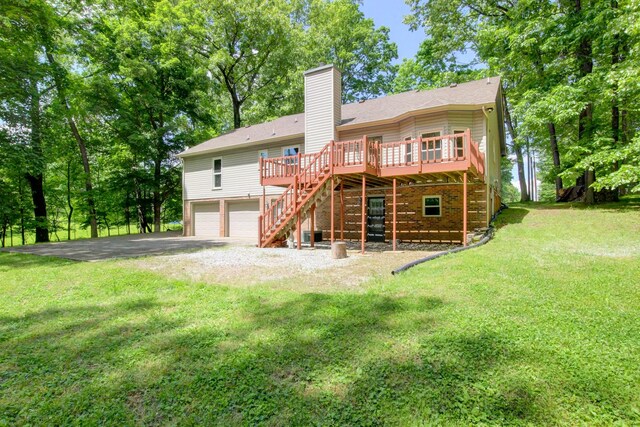 1420 E Rhett Butler Rd, Clarksville, TN 37042 - rear view of property with stairs, an attached garage, a chimney, a wooden deck, and asphalt driveway