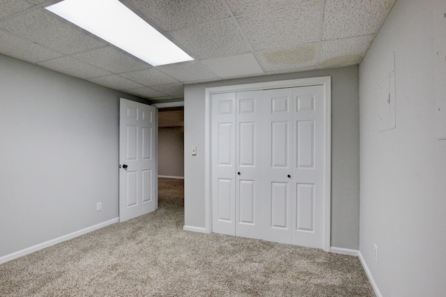 1420 E Rhett Butler Rd, Clarksville, TN 37042 - unfurnished bedroom featuring carpet floors, a paneled ceiling, a closet, and baseboards