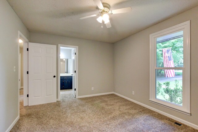 1420 E Rhett Butler Rd, Clarksville, TN 37042 - empty room with carpet, a ceiling fan, and baseboards