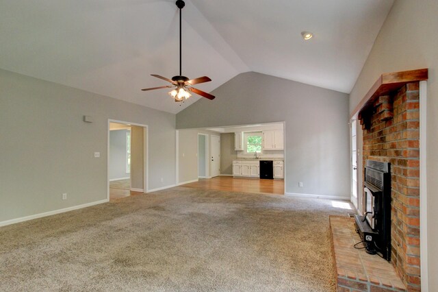 1420 E Rhett Butler Rd, Clarksville, TN 37042 - unfurnished living room with light colored carpet, lofted ceiling, ceiling fan, and baseboards