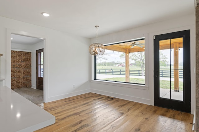4824 Leipers Creek Rd, Williamsport, TN 38487 - unfurnished dining area featuring light wood finished floors, a chandelier, baseboards, ceiling fan, and recessed lighting