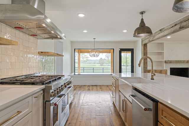 4824 Leipers Creek Rd, Williamsport, TN 38487 - kitchen with appliances with stainless steel finishes, exhaust hood, open shelves, a sink, and wood-type flooring