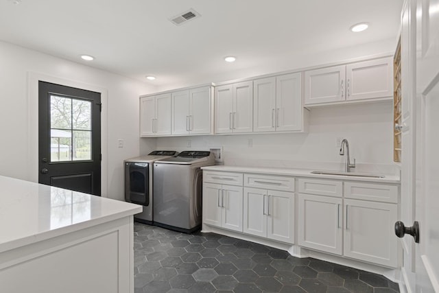 4824 Leipers Creek Rd, Williamsport, TN 38487 - laundry area with separate washer and dryer, cabinet space, recessed lighting, and dark tile patterned floors