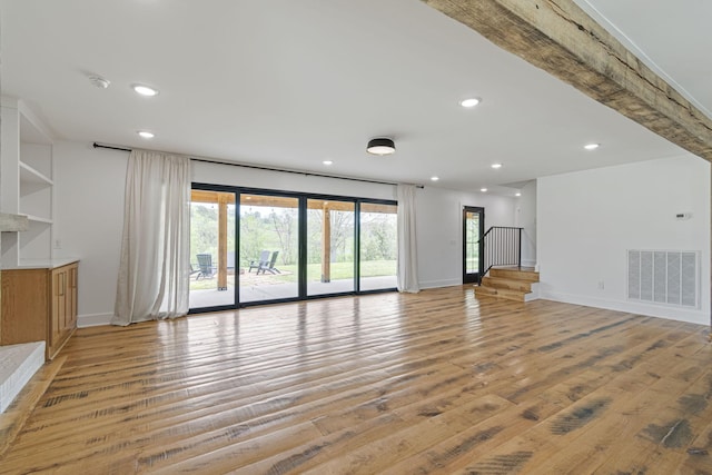 4824 Leipers Creek Rd, Williamsport, TN 38487 - unfurnished living room with recessed lighting, light wood finished floors, baseboards, and stairway