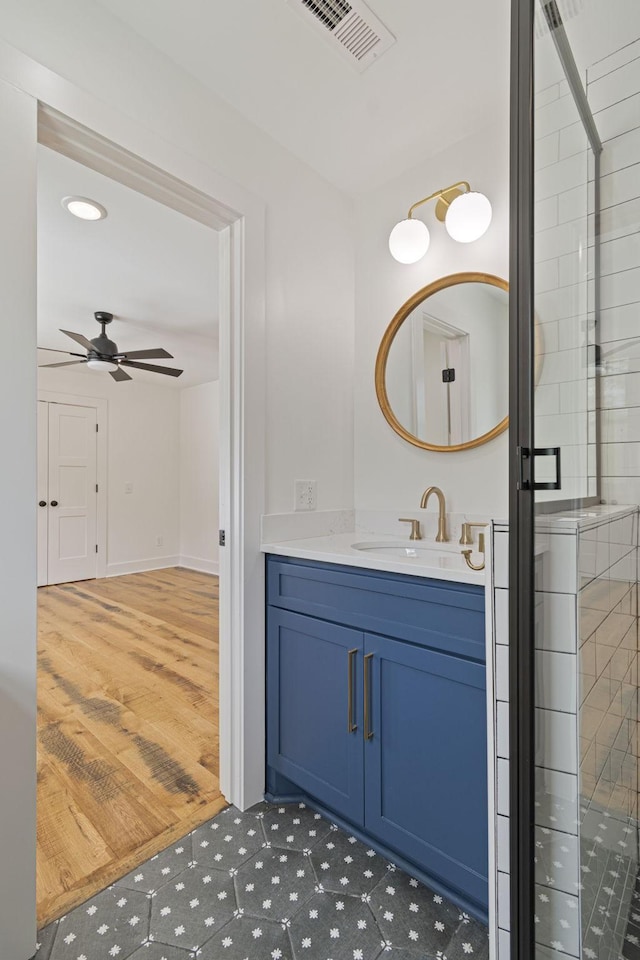 4824 Leipers Creek Rd, Williamsport, TN 38487 - bathroom with vanity, a ceiling fan, wood finished floors, and recessed lighting
