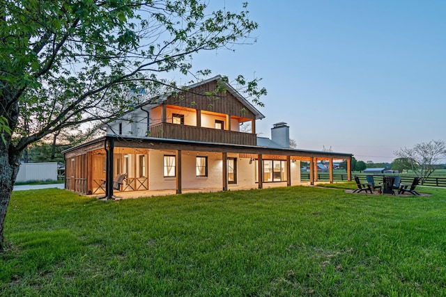 4824 Leipers Creek Rd, Williamsport, TN 38487 - rear view of house featuring a chimney and a balcony