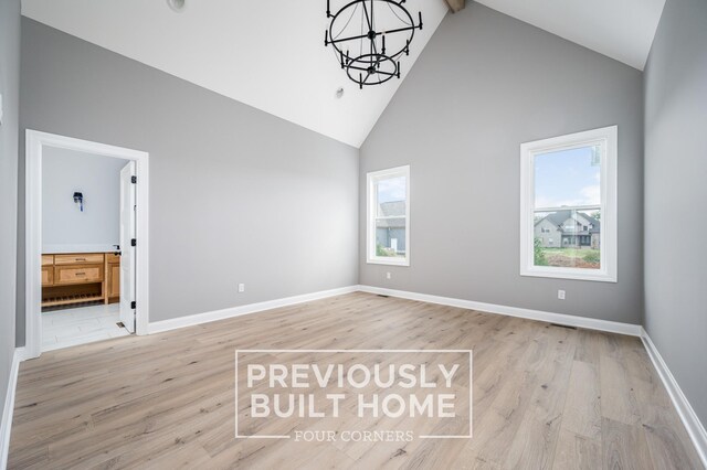 5517 Sinclair St, Murfreesboro, TN 37127 - empty room with high vaulted ceiling, a chandelier, light wood-type flooring, and beamed ceiling