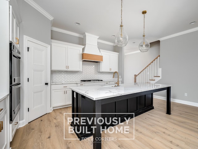 5517 Sinclair St, Murfreesboro, TN 37127 - kitchen with double oven, white cabinets, gas cooktop, decorative backsplash, and light wood-type flooring