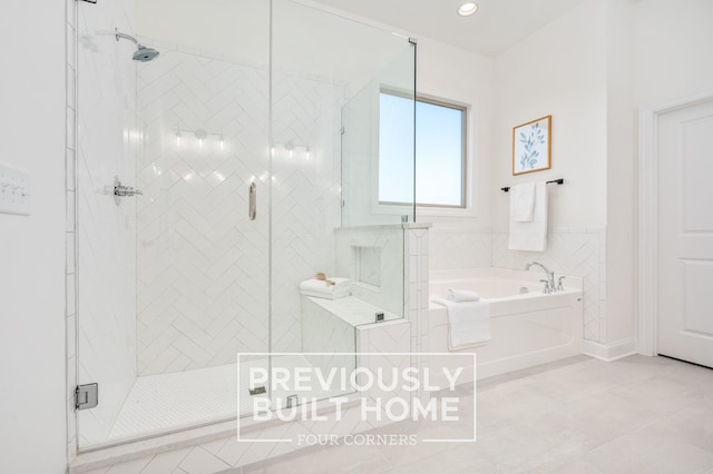 5520 Sinclair St, Murfreesboro, TN 37127 - bathroom featuring a bath, a stall shower, tile patterned flooring, and recessed lighting