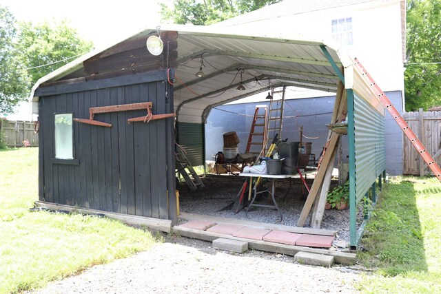 518 Mcdowell Ln, Lewisburg, TN 37091 - view of outbuilding featuring fence, a detached carport, and an outbuilding