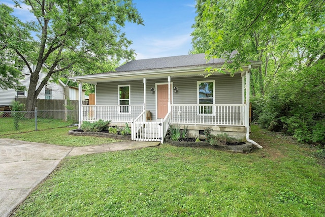 view of front of home featuring covered porch and a shingled roof
