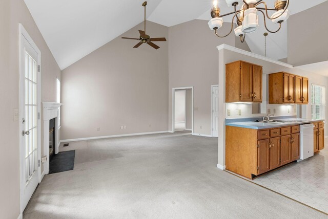 kitchen with white dishwasher, high vaulted ceiling, light countertops, light colored carpet, and a ceiling fan