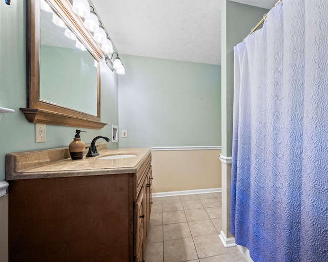 1015 Cross Country Dr, Kingston Springs, TN 37082 - bathroom featuring a textured ceiling, tile patterned flooring, vanity, and baseboards