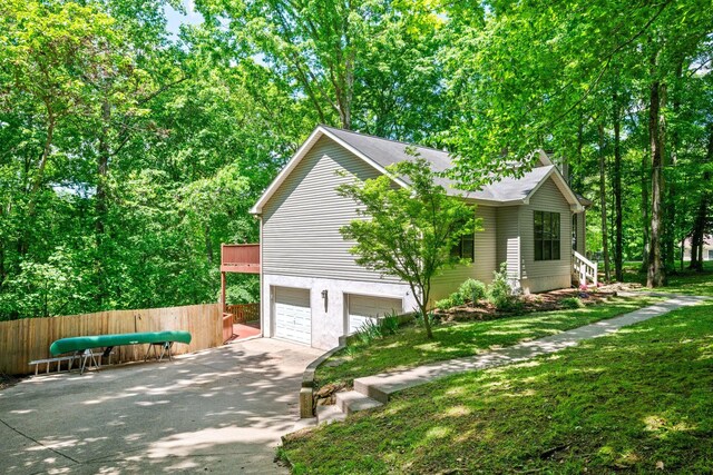 1015 Cross Country Dr, Kingston Springs, TN 37082 - view of home's exterior featuring driveway, a garage, and roof with shingles