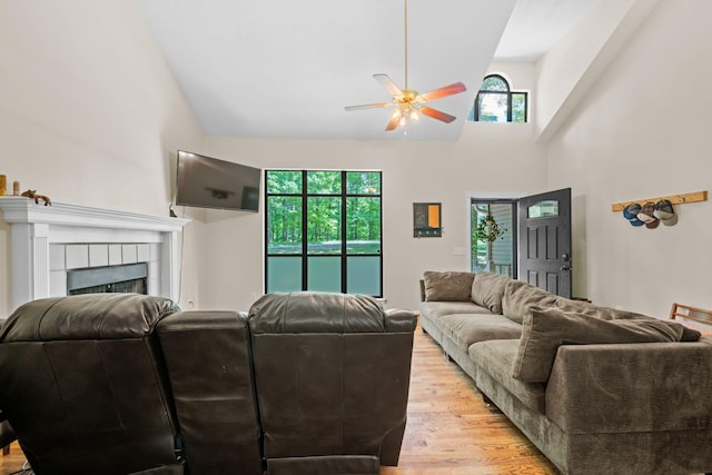 1015 Cross Country Dr, Kingston Springs, TN 37082 - living area with ceiling fan, light wood-style flooring, high vaulted ceiling, and a fireplace