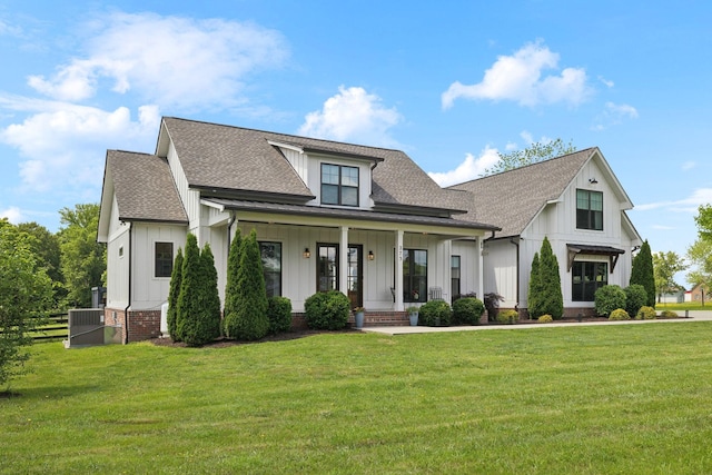 273 Halltown Rd, Cottontown, TN 37048 - modern farmhouse style home featuring board and batten siding, roof with shingles, a porch, and a front lawn