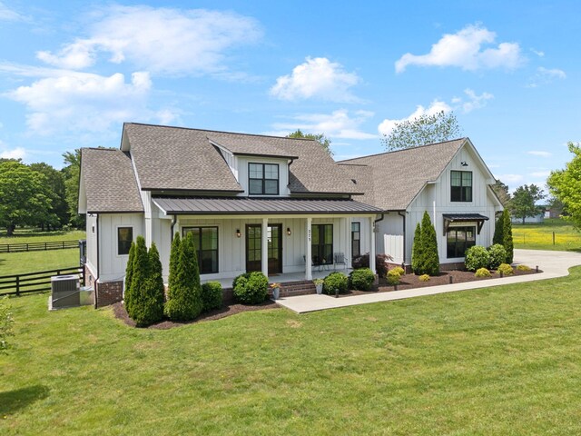 273 Halltown Rd, Cottontown, TN 37048 - modern inspired farmhouse with board and batten siding, a porch, roof with shingles, and central AC