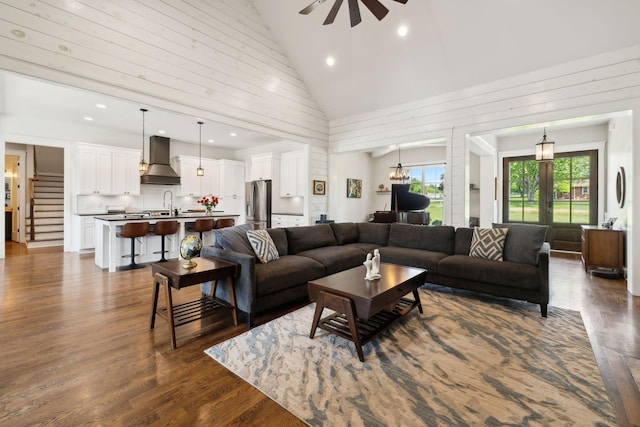 273 Halltown Rd, Cottontown, TN 37048 - living area featuring ceiling fan, dark wood-type flooring, high vaulted ceiling, recessed lighting, and stairs