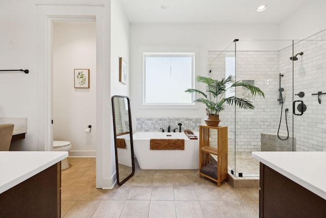 273 Halltown Rd, Cottontown, TN 37048 - full bathroom with a shower stall, vanity, toilet, tile patterned floors, and a freestanding bath