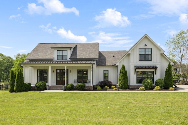 273 Halltown Rd, Cottontown, TN 37048 - modern farmhouse style home with board and batten siding, a standing seam roof, roof with shingles, a porch, and a front lawn
