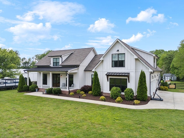 273 Halltown Rd, Cottontown, TN 37048 - modern farmhouse style home featuring a standing seam roof, board and batten siding, covered porch, metal roof, and roof with shingles